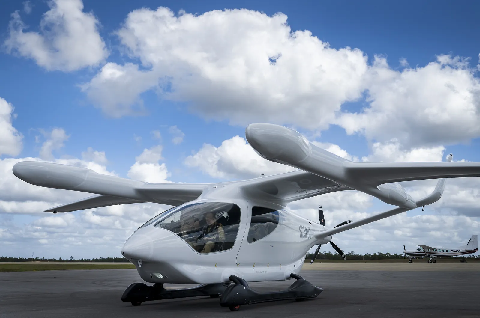 BETA ALIA electric vertical takeoff aircraft on the ramp under a blue sky